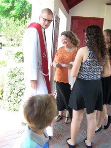 Fr. James Dorn greets parishioners.